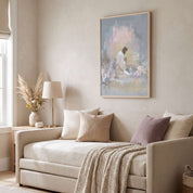 Framed Jesus praying in Gethsemane wall art above a beige sofa in a neutral living room, featuring Christ kneeling in a pastel watercolor garden.