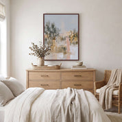 Framed watercolor Christian wall art of Jesus and the Samaritan woman above a light wood bedroom dresser, a peaceful reminder of John 4 and eternal life in Christ.
