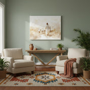 hristian wall art canvas of Jesus the Shepherd walking with His flock, displayed above a wooden console between two cream armchairs in a cozy living room.