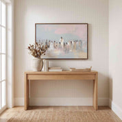 Framed Jesus teaching the people wall art above a light oak entryway console, depicting Christ speaking to a gathered crowd in soft watercolor colors.