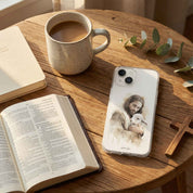 Phone case with a religious design on a wooden table with a cup of coffee, open book, and cross.