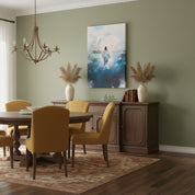 Large Jesus walking on water canvas artwork in a dining room with green walls and elegant chandelier.