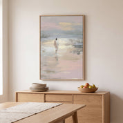 Framed soft pastel minimalist Christian canvas of Jesus walking on water displayed in a modern Scandinavian dining room above a light wood sideboard.