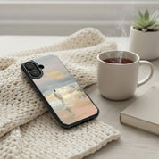 Jesus Walking on Water MagSafe® clear iPhone case resting beside a warm cup of tea and devotional book in a cozy Christian morning setting