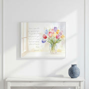 John 14:27 Bible verse wall art with a watercolor tulip bouquet displayed above a white console table and blue vase in a bright neutral room.