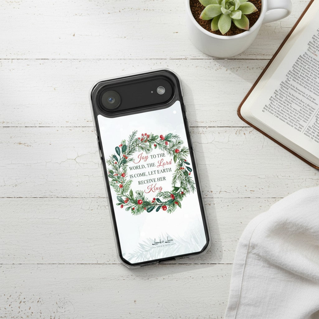 Joy to the World Christmas MagSafe iPhone case with watercolor evergreen wreath and holly berries.
