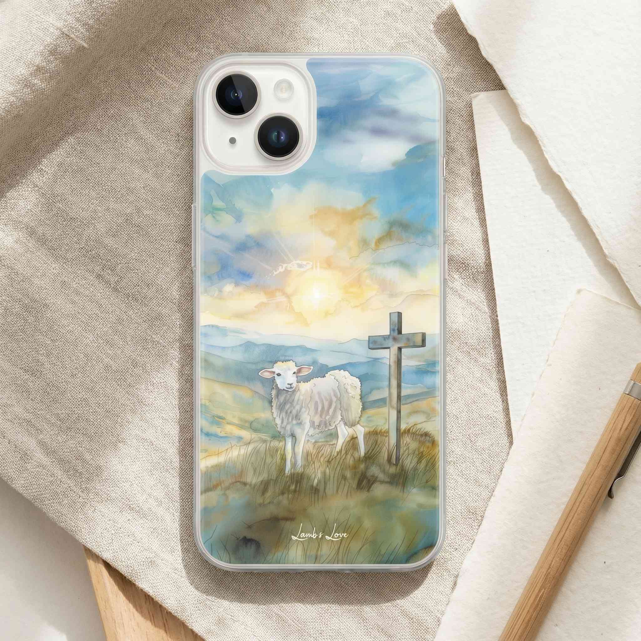 Phone case with a lamb and cross design on a textured surface