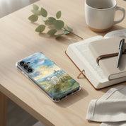 Lamb of God Samsung phone case with lamb and cross in peaceful landscape on desk with open Bible coffee mug notebook and pen in soft natural light symbolizing Jesus who takes away the sin of the world John 1:29