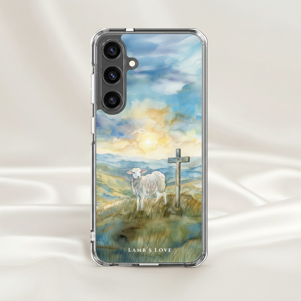 Lamb of God Samsung phone case with lamb and cross in peaceful landscape displayed on soft white silk background symbolizing Jesus who takes away the sin of the world John 1:29