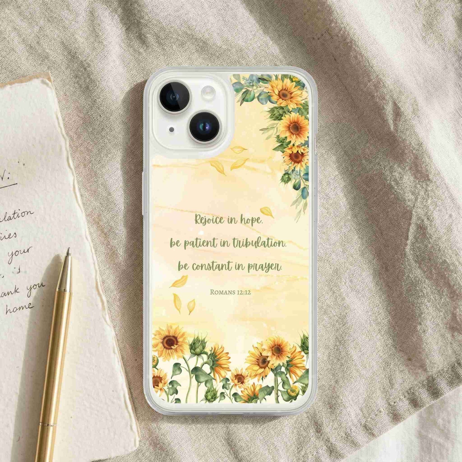 Phone case with sunflower design and inspirational quote on a textured surface