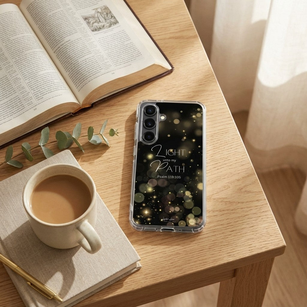 Samsung phone case with motivational quote on a desk with coffee, book, and plant