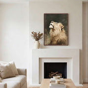 Lion of Judah Christian wall art displayed above a fireplace mantel in modern home, featuring a majestic lion looking upward in a warm, classic reading nook.