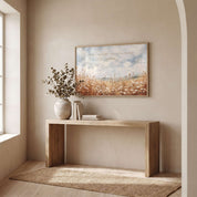 Matthew 6:28 wildflower wall art showing a peaceful field of white blossoms, displayed above a light wood console table in a bright entryway.