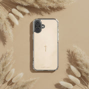 Minimalist cross Christian iPhone case on soft beige background surrounded by dried pampas grass in warm neutral botanical flat lay style