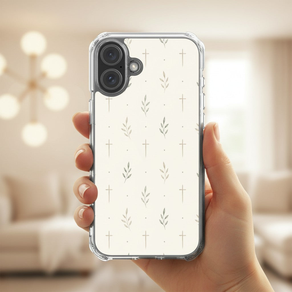 Minimalist cross and olive branch Christian MagSafe iPhone case held in hand with soft neutral indoor lifestyle aesthetic and modern faith-inspired design