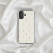 Minimalist cross and olive branch Christian MagSafe iPhone case on soft white silk fabric background with elegant neutral aesthetic and faith-inspired design