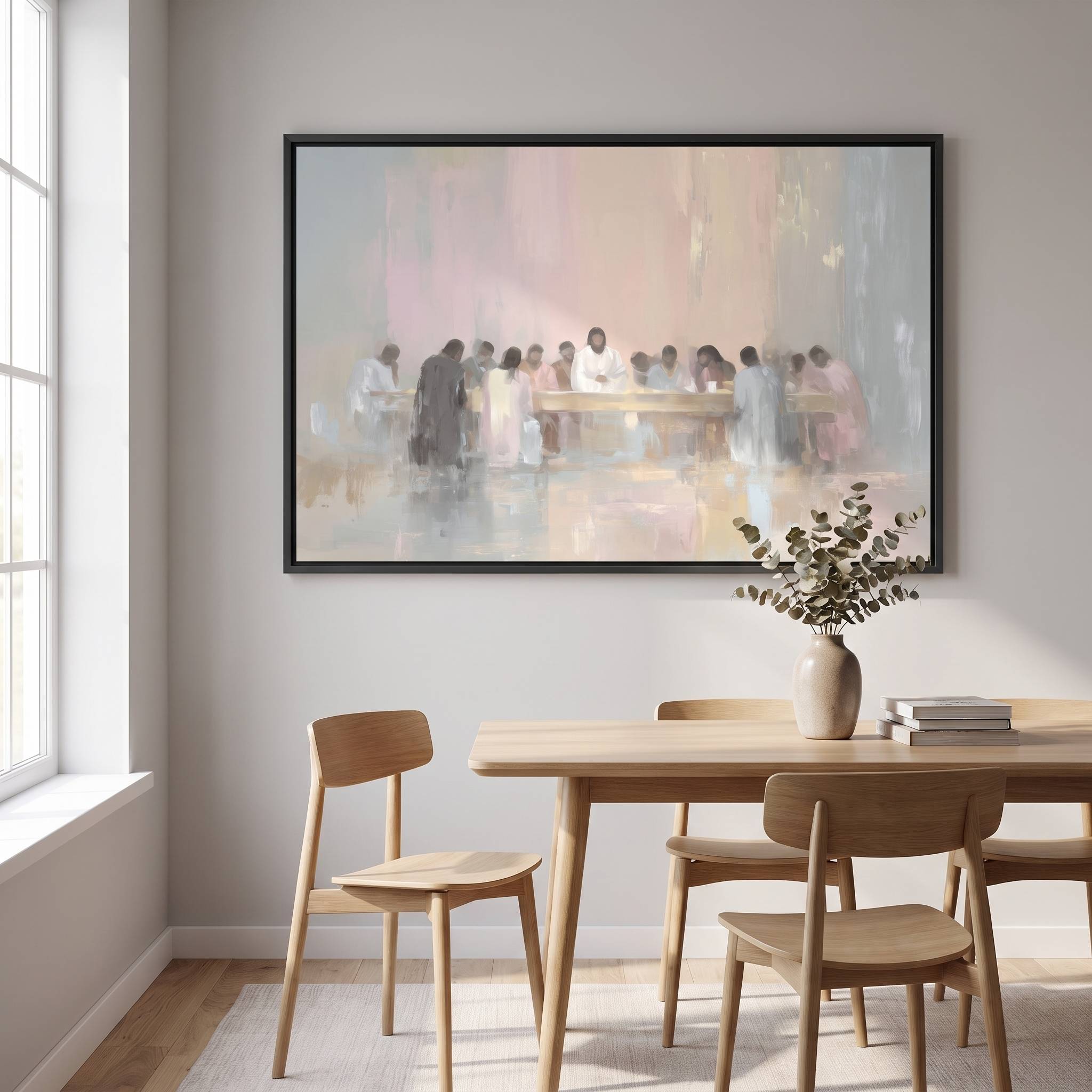 Large framed minimalist Last Supper watercolor Christian wall art in soft neutral tones hanging above a wooden dining table in a bright Scandinavian dining room.