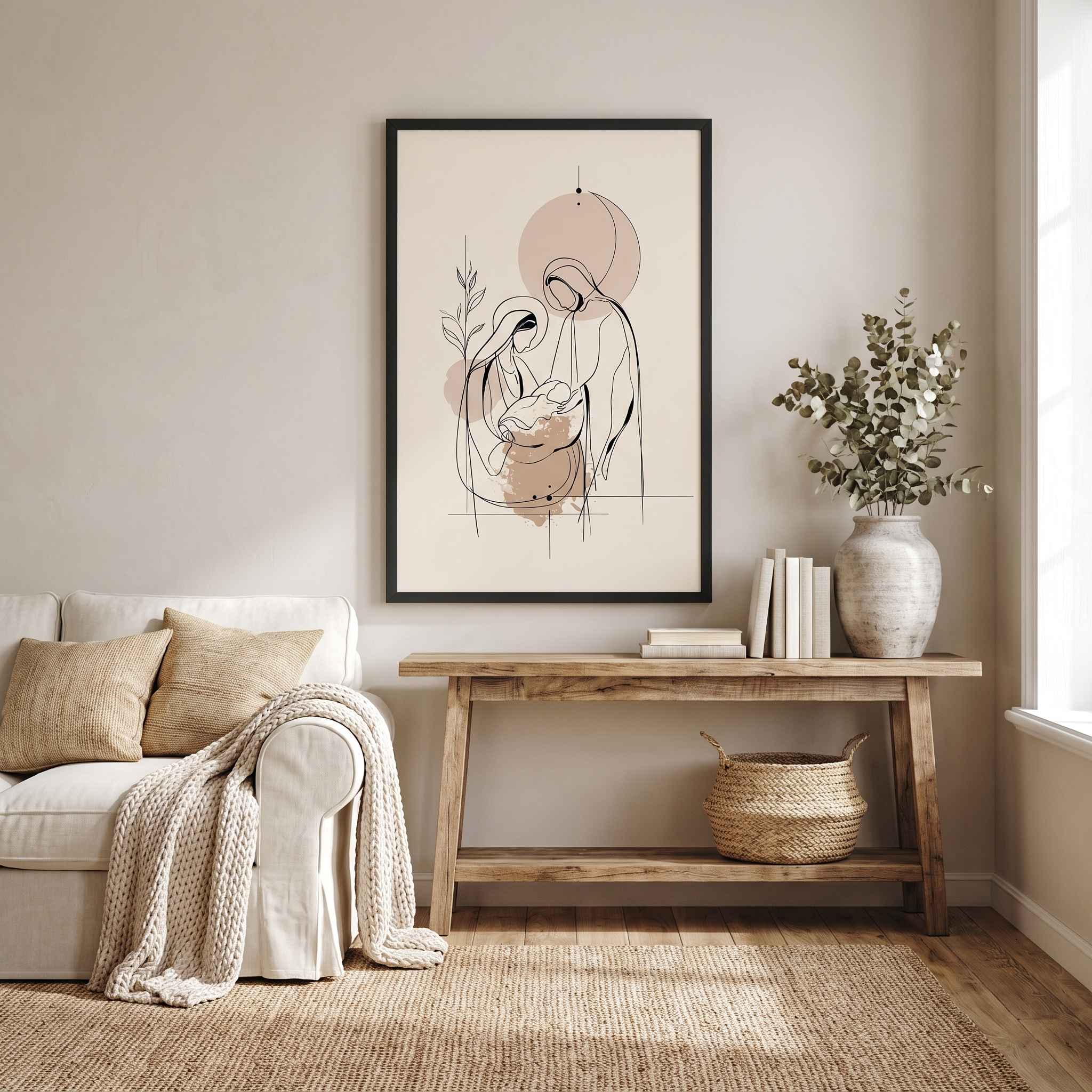 Minimalist line art print of the Nativity scene framed in black hanging above a wooden console table decorated with a wooden manger set and candles.