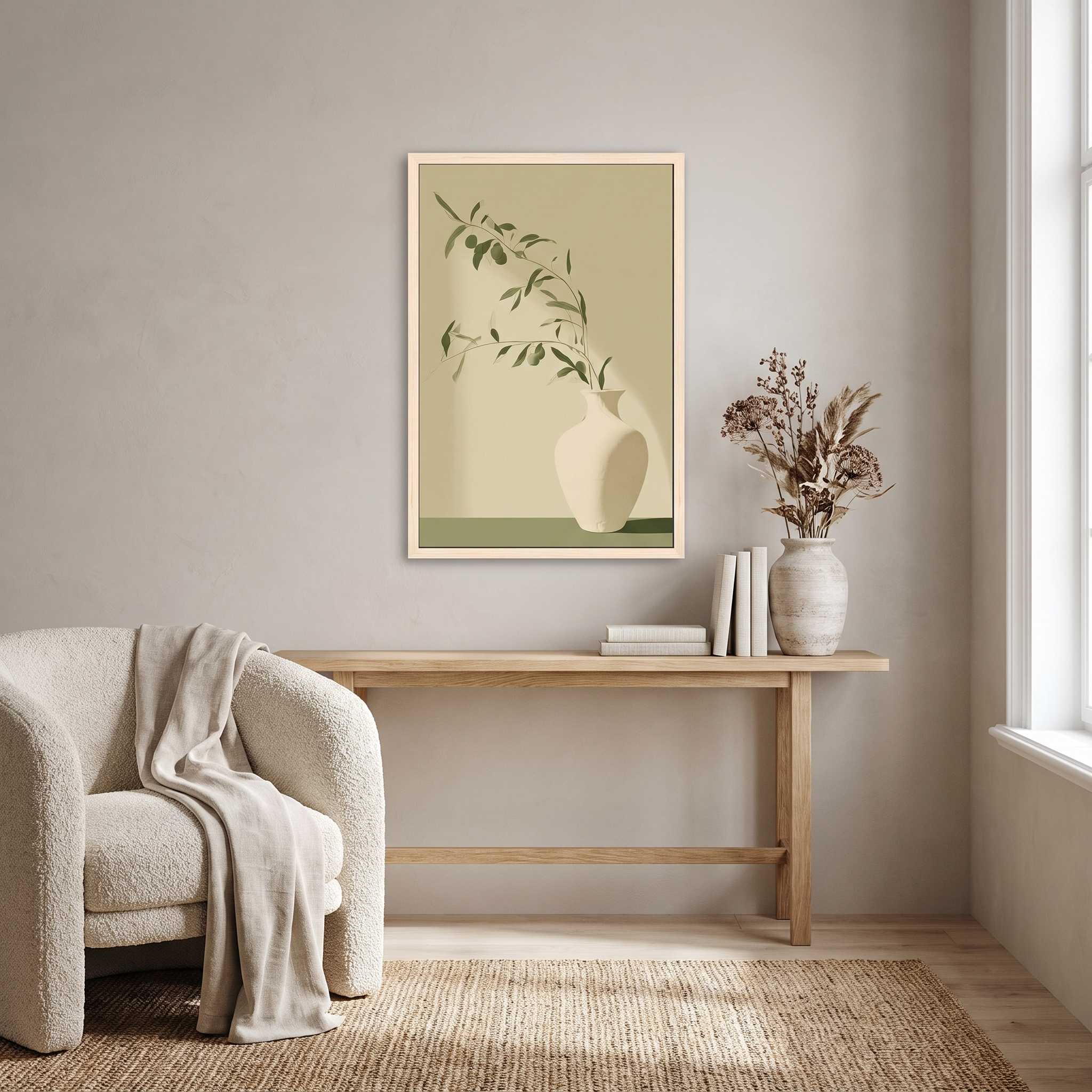 Minimalist olive branch in a white ceramic vase vertical framed canvas Christian wall art in soft sage green displayed on a beige wall above a light wood console table beside a cream armchair in an organic modern living room.