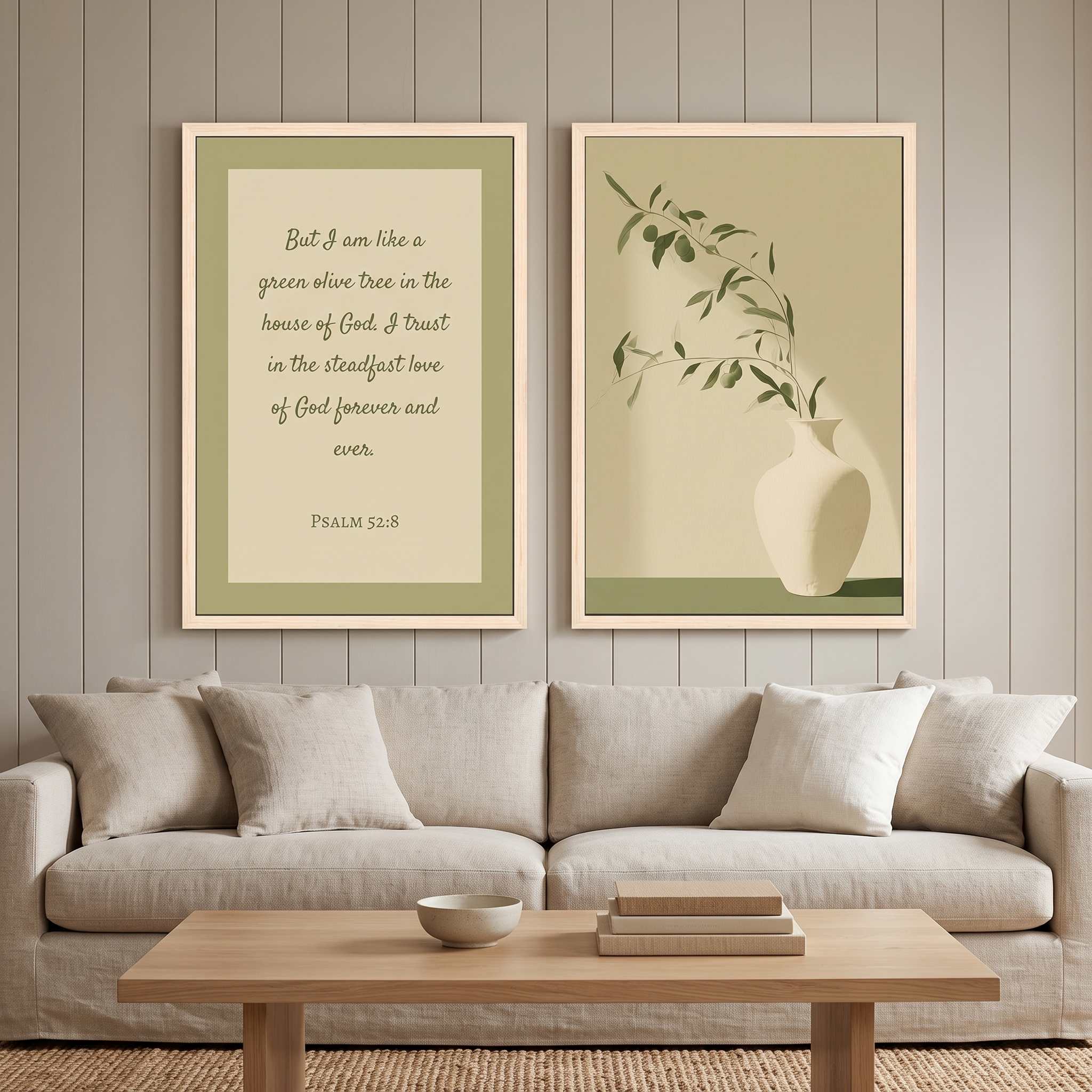 Minimalist Psalm 52:8 Scripture and olive branch 2-piece framed canvas Christian wall art set displayed on a neutral paneled wall above a light beige sofa in an organic modern living room.