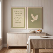 Minimalist Romans 15:13 Scripture and white dove 2-piece framed canvas wall art set displayed on a beige paneled wall above a light wood sideboard in an organic modern dining room.