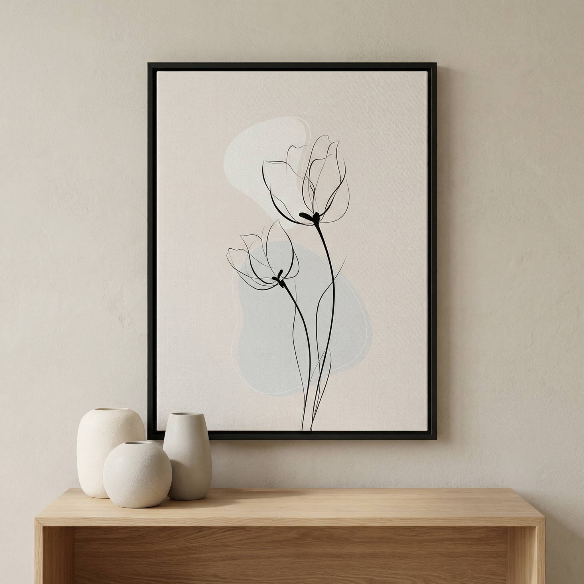 Minimalist tulip line art print in a black frame, styled in a modern living room above a wooden console table with neutral decor.