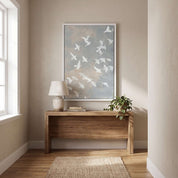 Framed minimalist white dove Christian wall art featuring peaceful flying doves, displayed above a light wood console table in a bright, modern hallway entry.