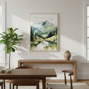 Mountain stream watercolor Christian wall art with John 14:27 verse, displayed on a modern green wall above a wooden shelf.