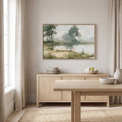 Framed vintage John 14:27 landscape canvas wall art hanging above a light wood sideboard in a bright Scandinavian dining room.