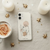Nativity Scene Christian MagSafe iPhone case beside hot cocoa and candles with cozy Christmas flat lay aesthetic featuring minimalist Holy Family artwork and warm neutral tones