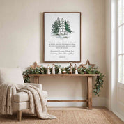 Our Savior Is Born Isaiah 9:6 framed canvas print with watercolor snowy pine trees displayed on a beige wall above a decorated wooden console table in a modern living room.
