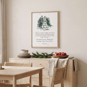 Our Savior Is Born Isaiah 9:6 framed canvas print with watercolor snowy pine tree displayed above a light wood sideboard in a Scandinavian dining room.