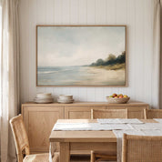 Framed vintage Mark 4:39 Christian landscape canvas wall art featuring a coastal beach scene hanging above a wooden sideboard with stacked plates and a fruit bowl in a warm dining room.