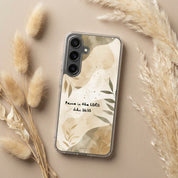 Christian Phone case with floral design and text on a beige surface with dried grasses