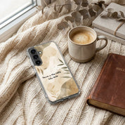 Samsung Phone case with nature design on a textured surface with a cup of coffee and book.