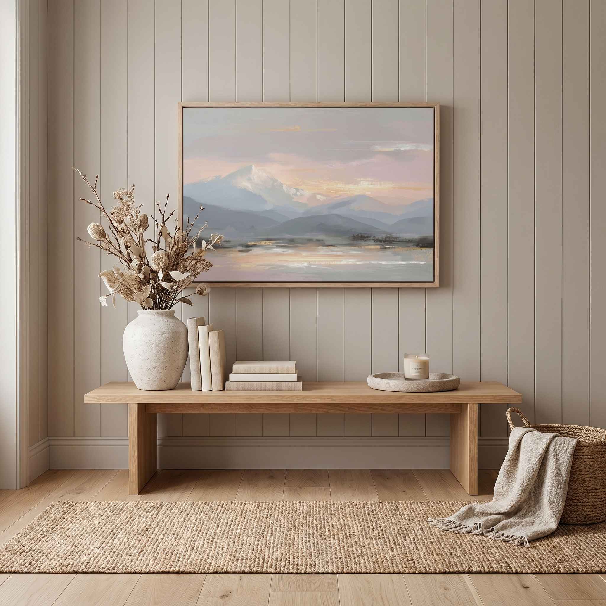 Framed Peace in the Mountains Christian landscape wall art featuring snowy peaks and a reflective lake, styled above an entryway bench with a vase and candle.