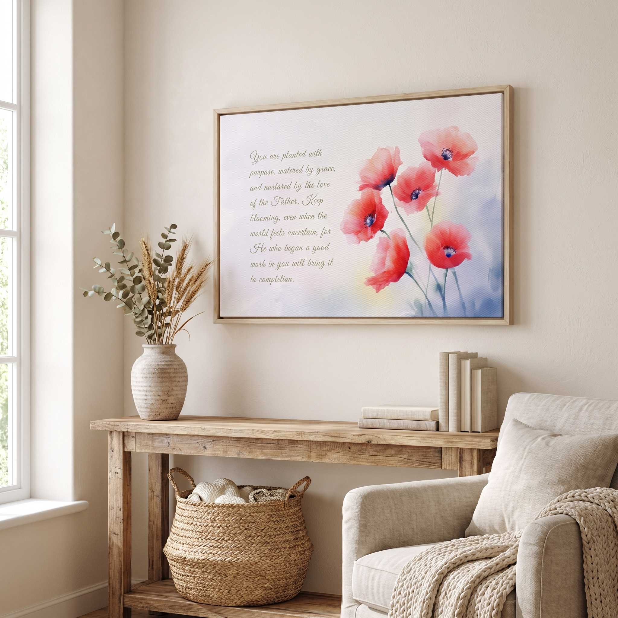 Philippians 1:6 red poppy Scripture wall art above a rustic wood console in a bright living room, styled with neutral decor and a cozy armchair.
