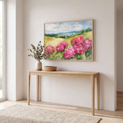 Framed Philippians 4:4 hydrangea wall art displayed above a console table in a bright neutral living room.