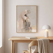 Framed Prodigal Son watercolor wall art showing a father welcoming his returning son, displayed above a light wood desk with a lamp and book in a calm home office.