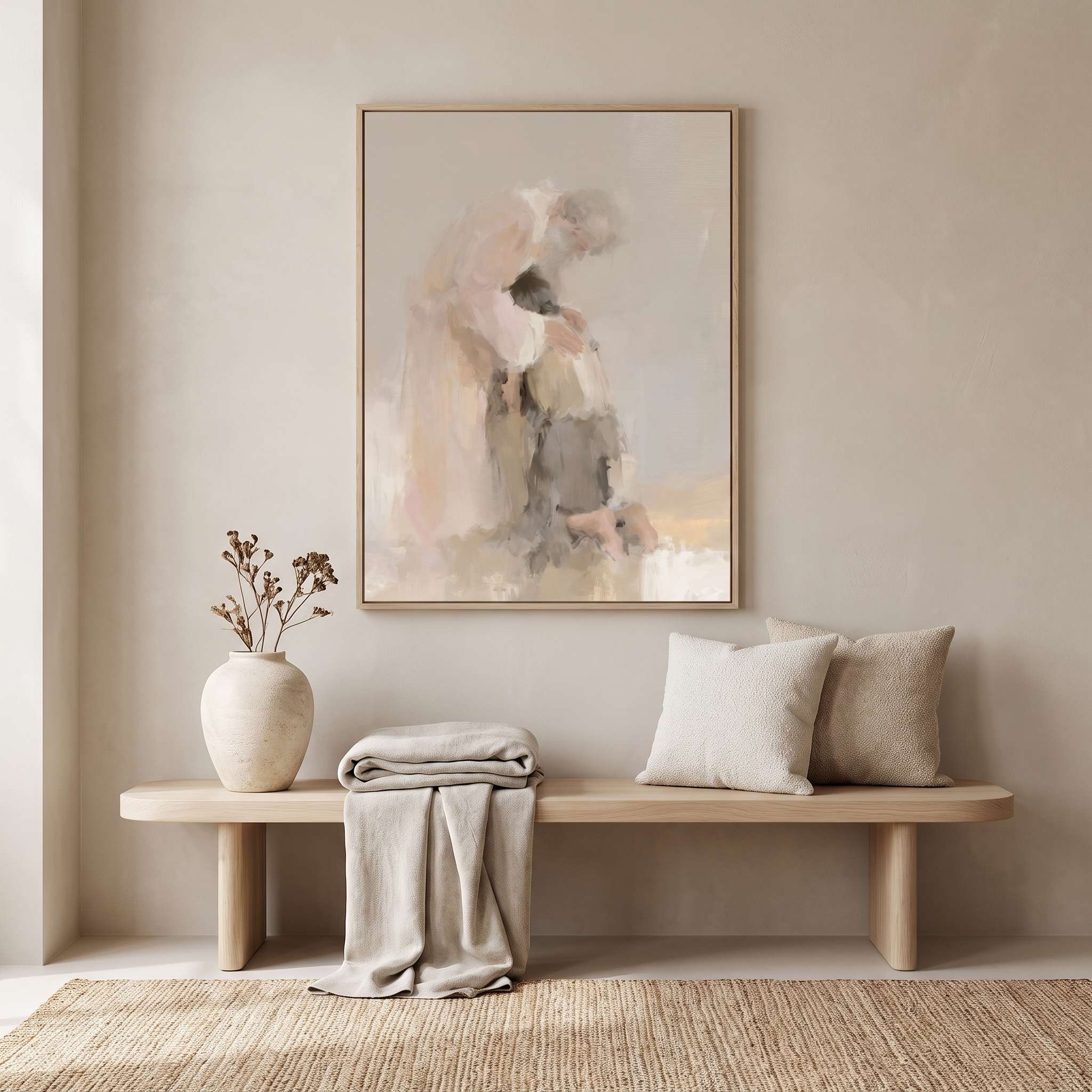 Watercolor Christian wall art of a father embracing his returning son, framed above an entryway bench with pillows and a vase in a neutral home interior.