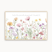 Framed watercolor wall art with pink, yellow, and purple wildflowers beneath Proverbs 3:5, ‘Trust in the Lord with all your heart.’