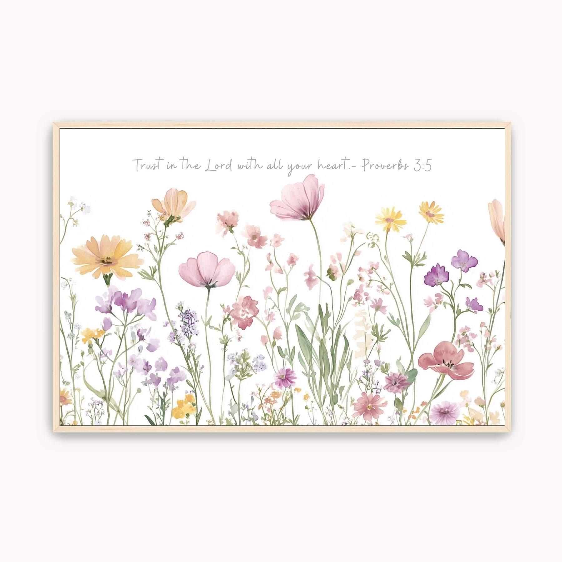 Framed watercolor wall art with pink, yellow, and purple wildflowers beneath Proverbs 3:5, ‘Trust in the Lord with all your heart.’