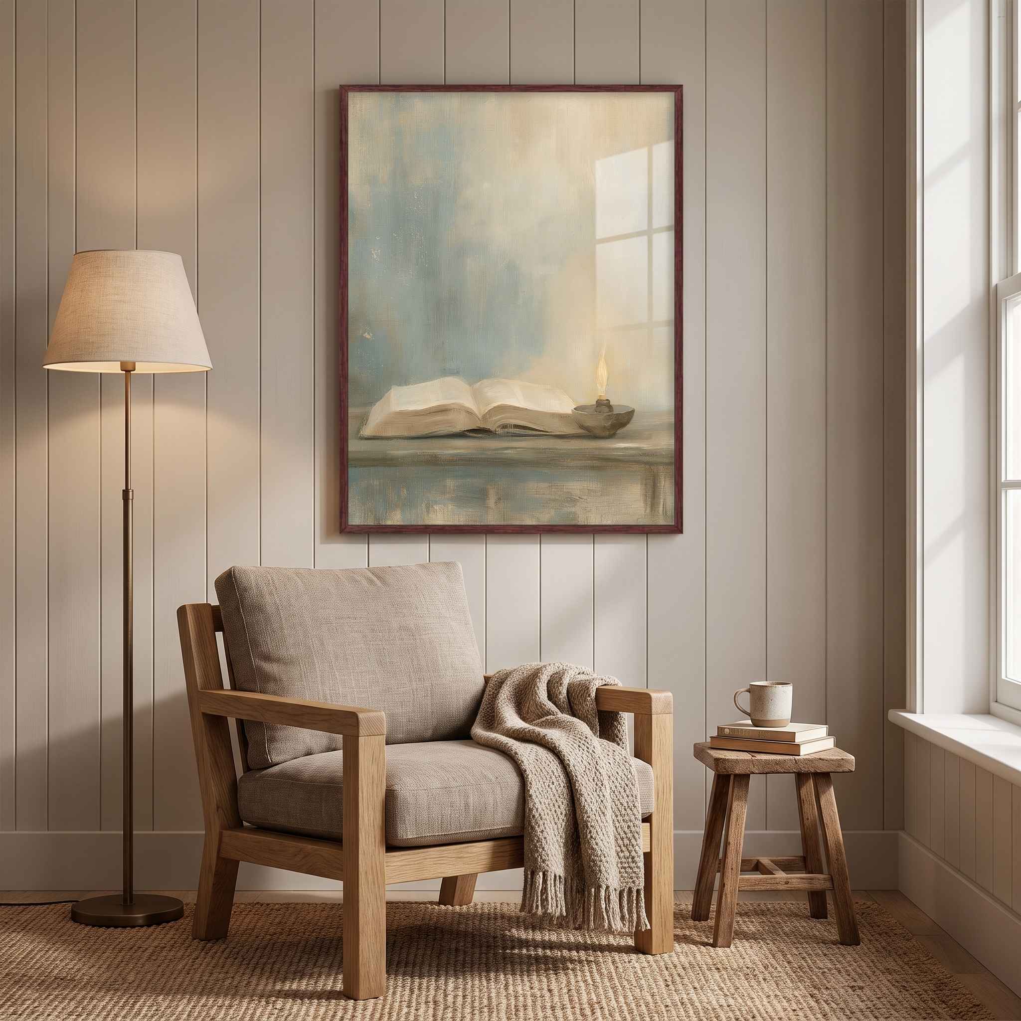 Framed Psalm 119:105 open Bible and oil lamp Christian wall art above a wooden reading chair with a knitted blanket beside a floor lamp and window.