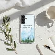 I Lift Up My Eyes Psalm 121:1-2 Christian Samsung Galaxy phone case with a watercolor mountain and forest design, placed on a sun-drenched white surface with soft shadows, an olive branch, and a notebook.