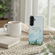 I Lift Up My Eyes Psalm 121:1-2 Christian Samsung Galaxy phone case with a watercolor mountain landscape, resting on a cozy knit blanket next to a steaming white mug.