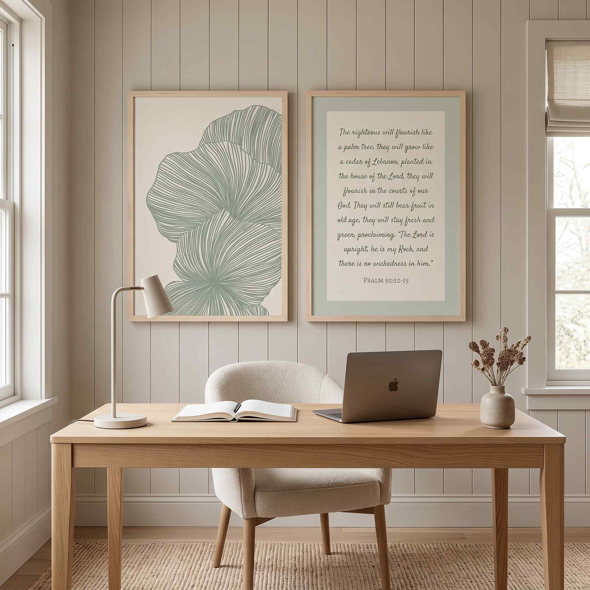 Two-piece framed poster gallery wall set featuring Psalm 92:12–15 Scripture and sage green minimalist botanical leaf line art, displayed in light wood frames on a warm beige vertical-paneled wall above a natural wood desk and bouclé chair in a bright modern home office.