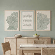 Three-piece framed canvas gallery wall set featuring Psalm 92:12–15 "The righteous will flourish like a palm tree" flanked by two sage green minimalist leaf line art prints, displayed in light wood frames on a sage green wall above a light wood sideboard in a soft organic modern dining room.
