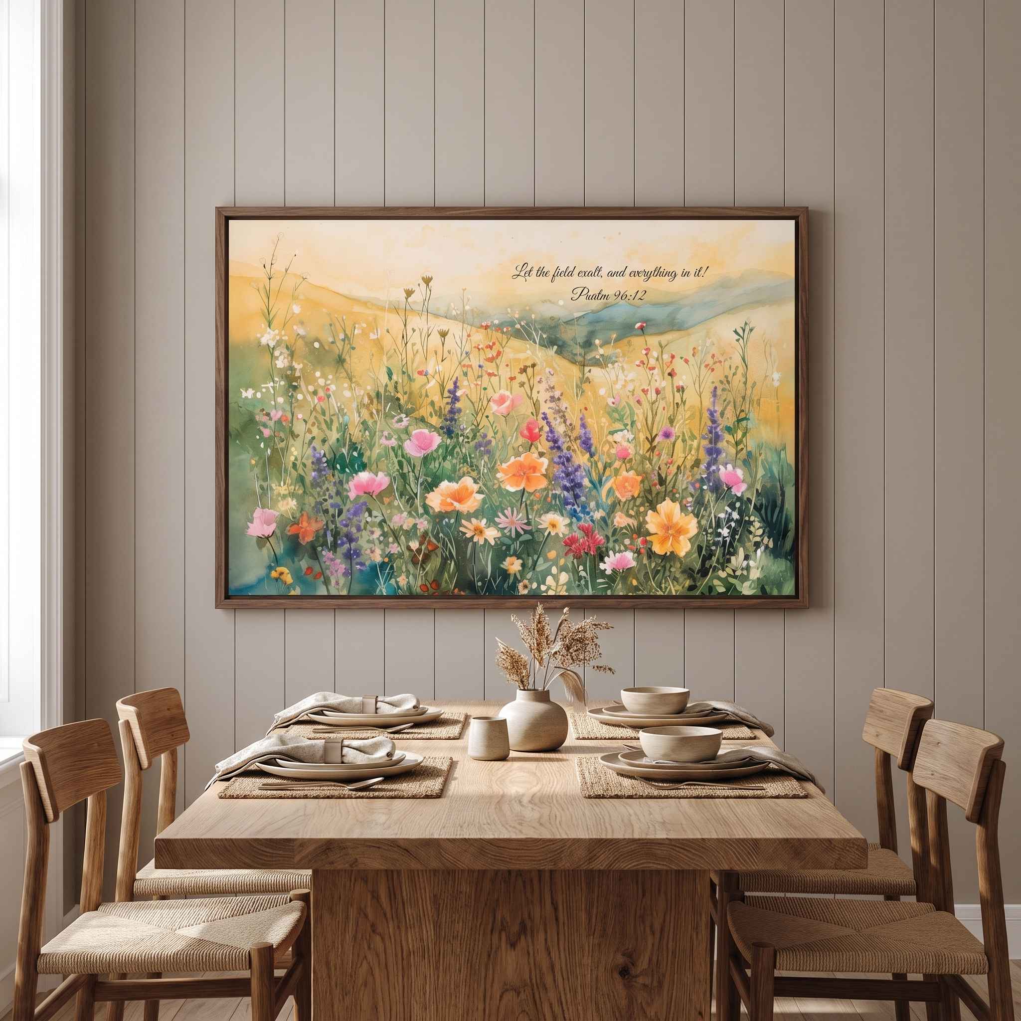Psalm 96:12 Christian wildflower meadow wall art above a rustic dining table, with a colorful watercolor landscape and Bible verse.