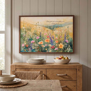 Psalm 96:12 wildflower meadow wall art above a wood kitchen sideboard, styled with plates and fruit in a bright dining space.