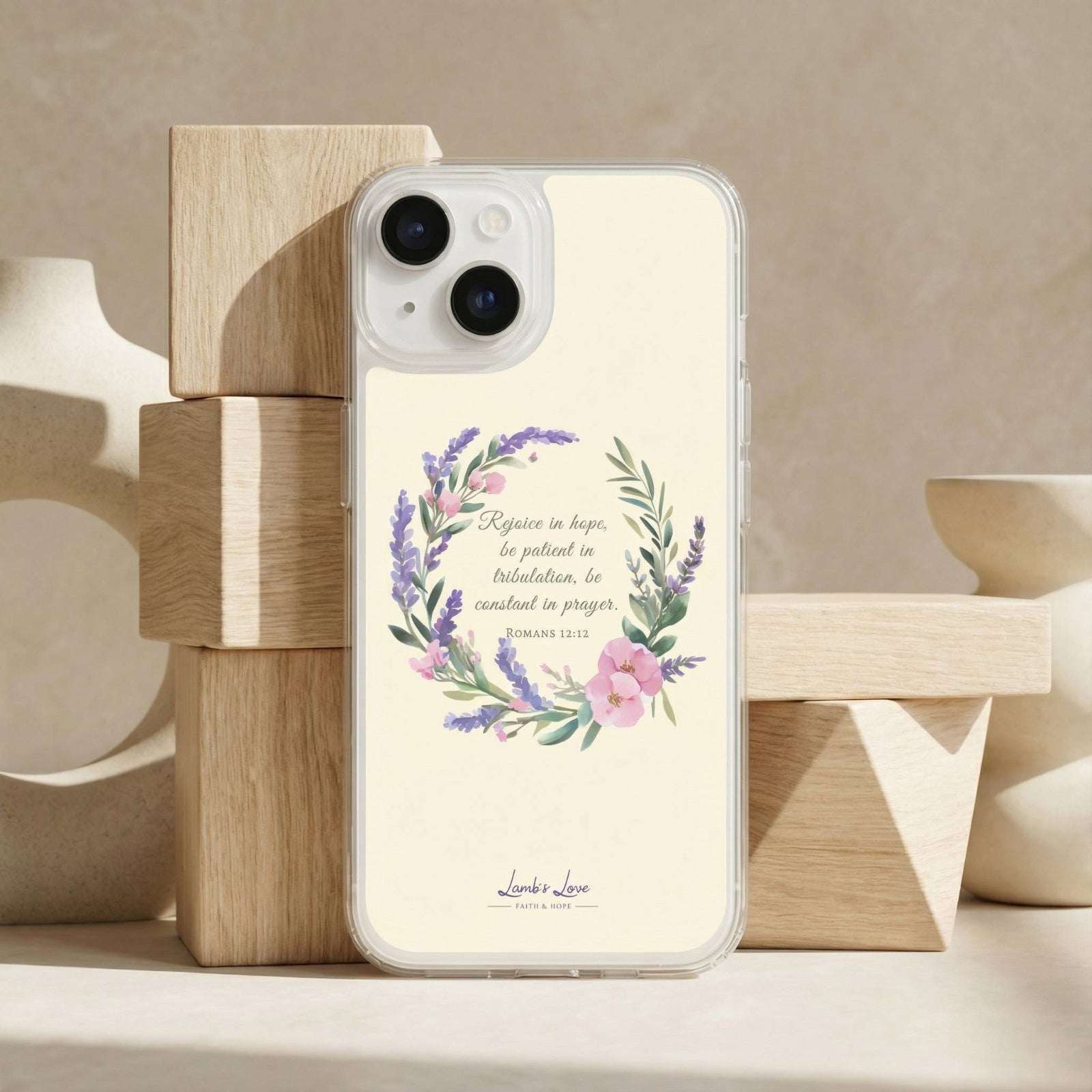 Phone case with floral design and text on a wooden stand
